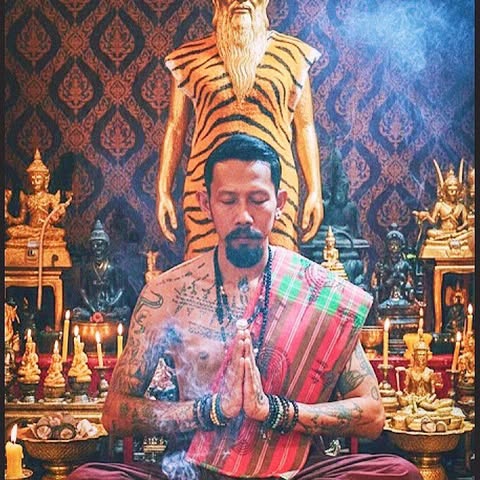 Ajarn Pol seated before a Buddhist monk